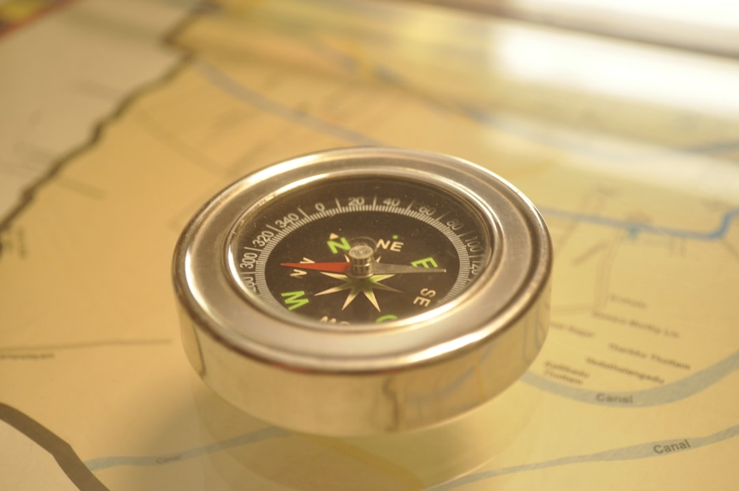 Sleek, modern compass rests on a clean, minimalist map, symbolizing the need for a new direction in measuring marketing su...