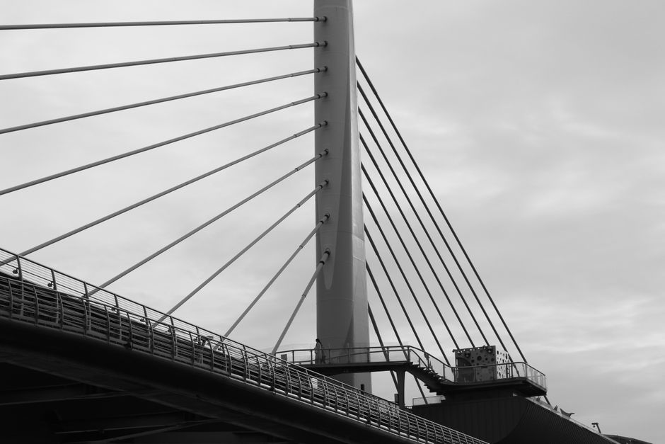 A sleek, modern architectural bridge with clean lines against a bright sky, symbolizing the strong, high-quality connections built through advanced link building.