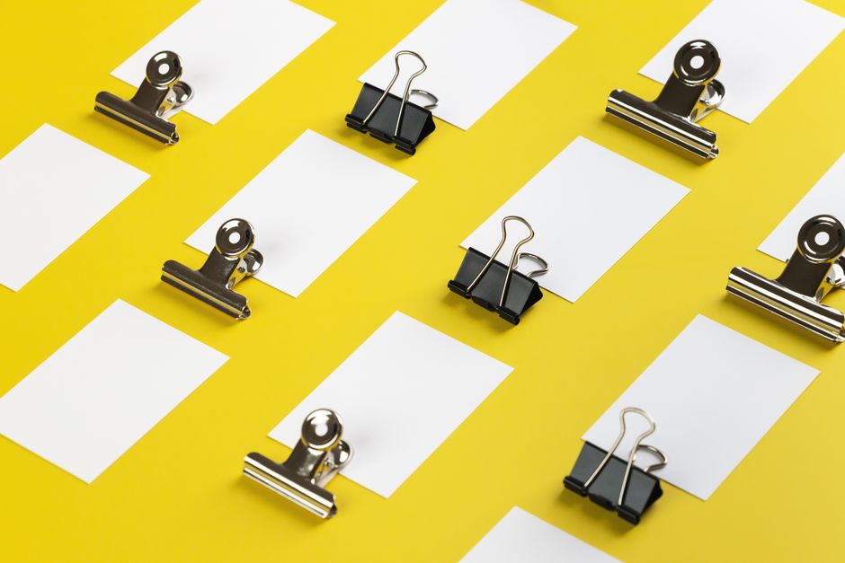 A sleek, modern magnet pulling a stream of paper clips towards it on a professional desk, illustrating the concept of attracting new business leads.